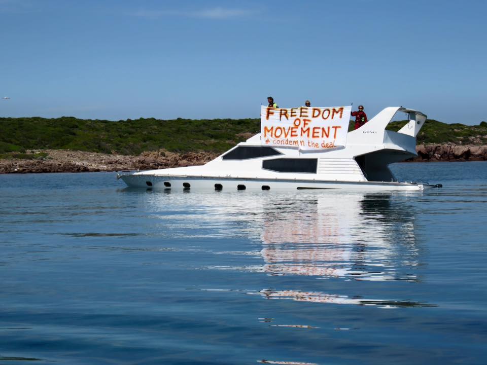 Freedom of movement banner on stranded refugee boat